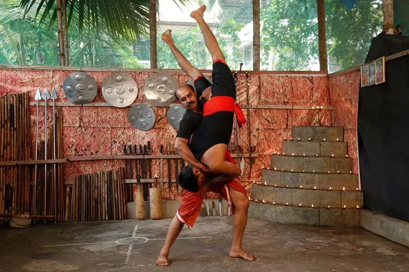 A lift and throw during partner practice at Sree Rudra Kalari, Tripunithura